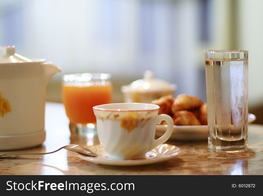 Cup of coffee and glass of mango juice. Cup of coffee and glass of mango juice