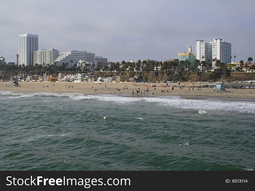 Waves coming ashore on sunny afternoon at Santa Monica Beach in California. Waves coming ashore on sunny afternoon at Santa Monica Beach in California.