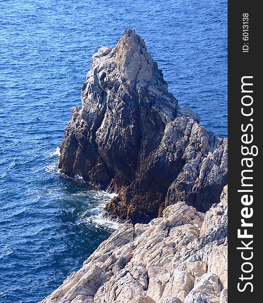 A beautiful shot of a rock in the Ligure sea. A beautiful shot of a rock in the Ligure sea