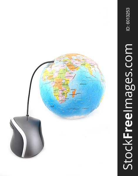 Isolated computer mouse connected to a globe. Shot over white background. Isolated computer mouse connected to a globe. Shot over white background