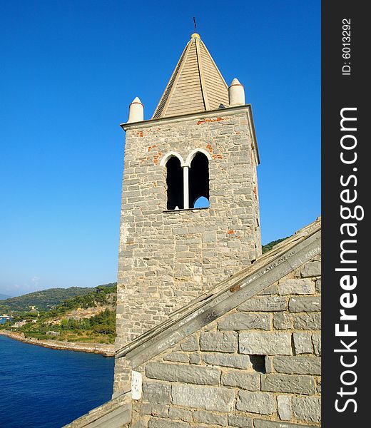 A beautiful shot of the belltower of San Pietro church in Porto Venere - Italy. A beautiful shot of the belltower of San Pietro church in Porto Venere - Italy