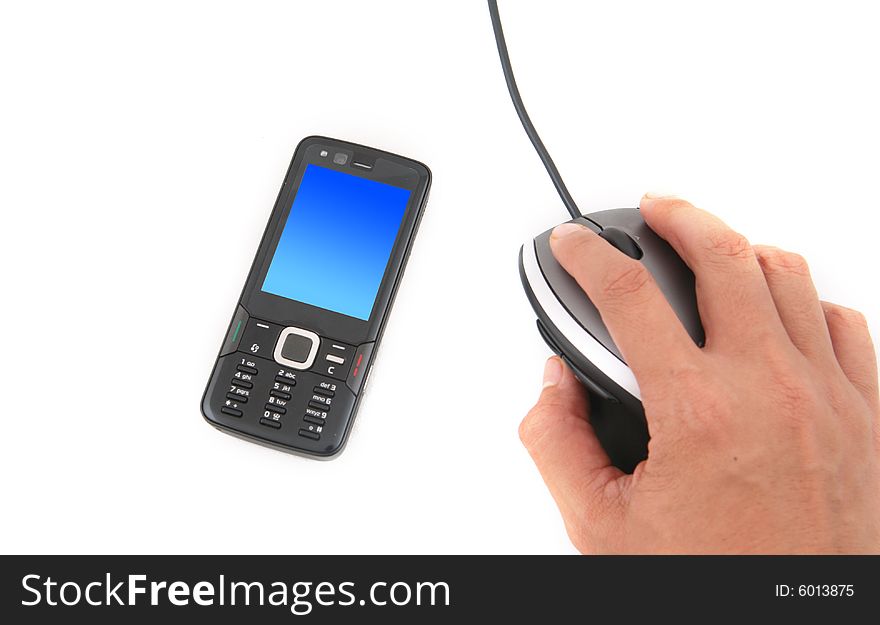 A man is using a mouse and a black mobile phone with a blank screen shot over white background. A man is using a mouse and a black mobile phone with a blank screen shot over white background