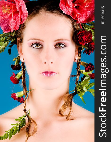 Young woman with big flowers in her hair. Young woman with big flowers in her hair