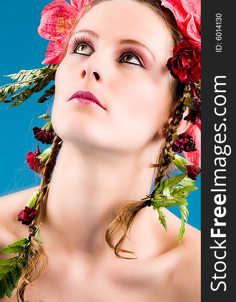 Young woman with big flowers in her hair. Young woman with big flowers in her hair