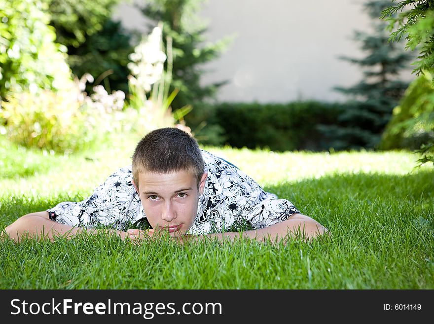 Happy boy lying on grass. Happy boy lying on grass