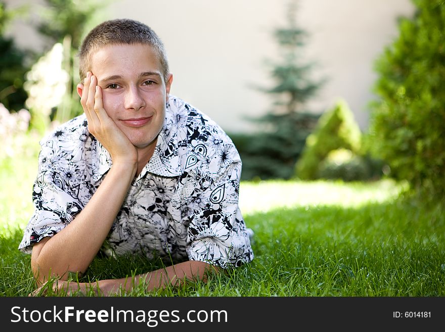 Happy boy lying on grass. Happy boy lying on grass