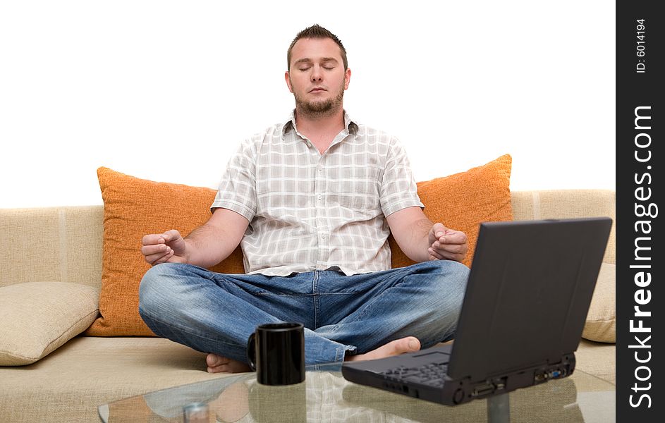 Happy man sitting on sofa with laptop. Happy man sitting on sofa with laptop