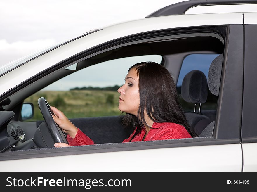 Attractive brunette woman traveling by car. Attractive brunette woman traveling by car