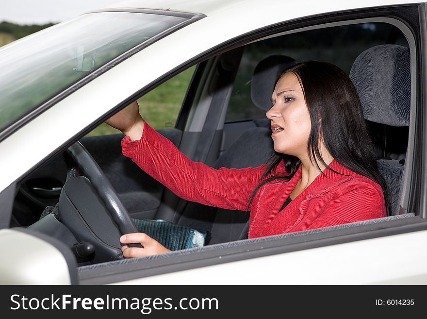 Attractive brunette woman traveling by car. Attractive brunette woman traveling by car