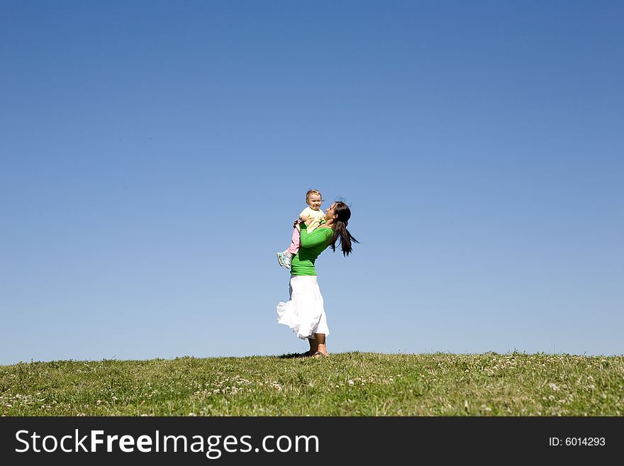 Active family on green meadow. Active family on green meadow