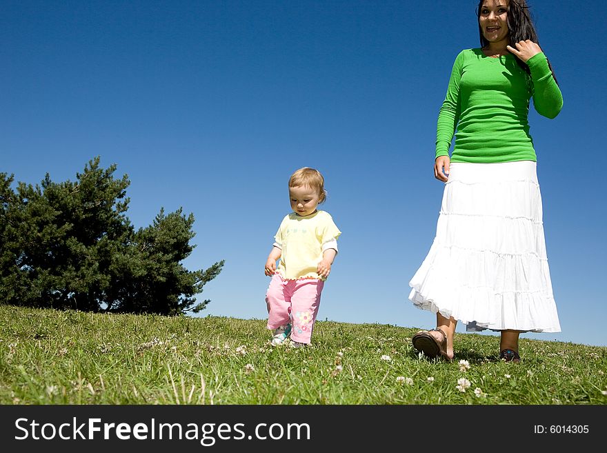 Active family on green meadow. Active family on green meadow