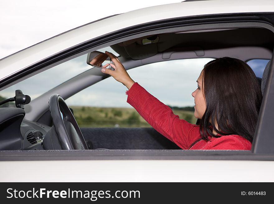 Attractive brunette woman traveling by car. Attractive brunette woman traveling by car