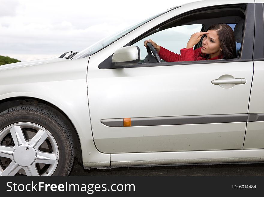 Attractive brunette woman traveling by car. Attractive brunette woman traveling by car