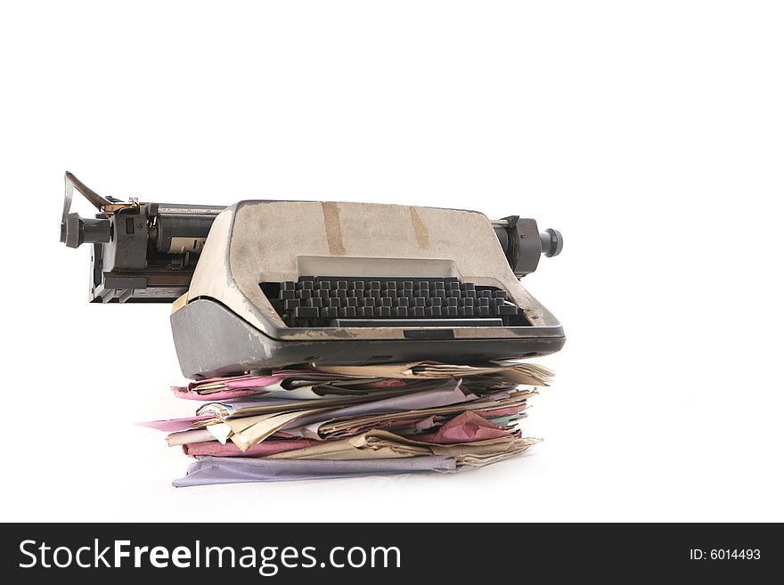 Isolated stack of folder with typewriter shot over white background. Isolated stack of folder with typewriter shot over white background