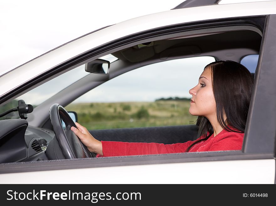 Attractive brunette woman traveling by car. Attractive brunette woman traveling by car