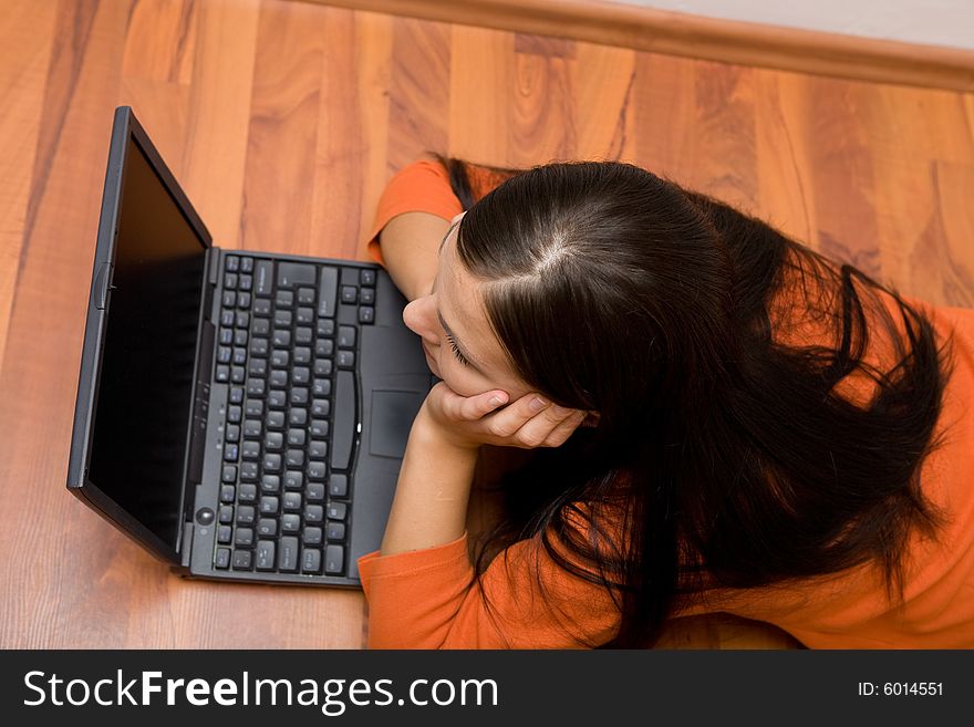 Casual woman lying on flor with laptop. Casual woman lying on flor with laptop