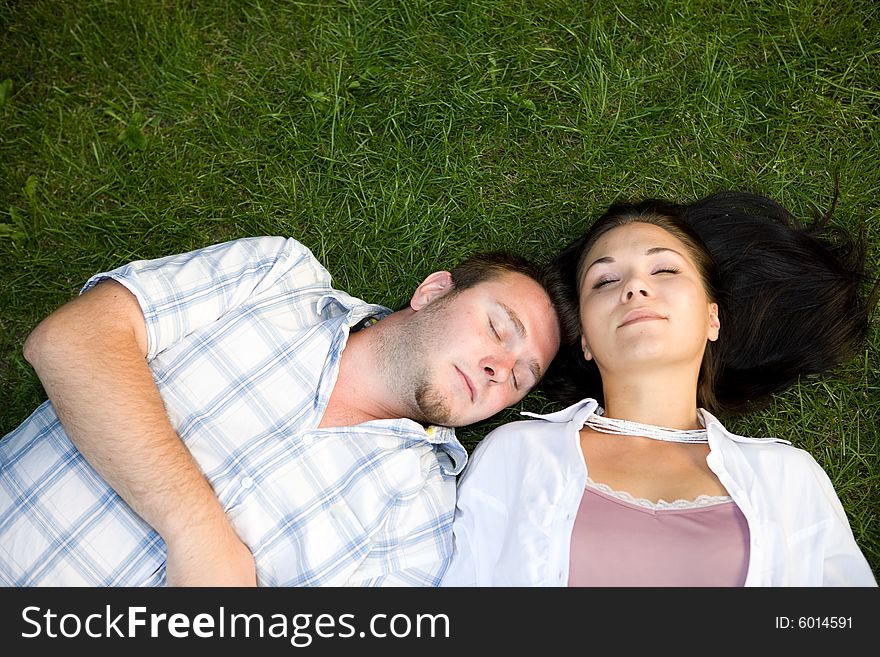 Happy couple lying on grass. Happy couple lying on grass