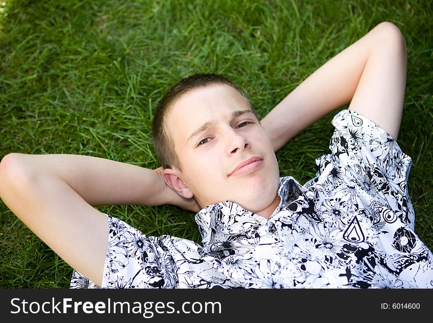 Happy boy lying on grass. Happy boy lying on grass