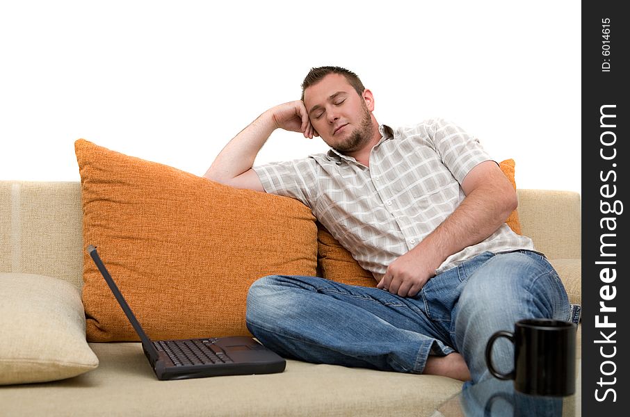 Happy man sitting on sofa with laptop. Happy man sitting on sofa with laptop