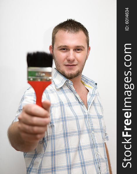 Happy casual man with paintbrush. Happy casual man with paintbrush