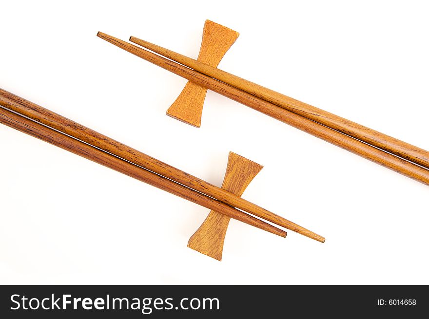 Two Pairs of Chopsticks Isolated on a White. Two Pairs of Chopsticks Isolated on a White.