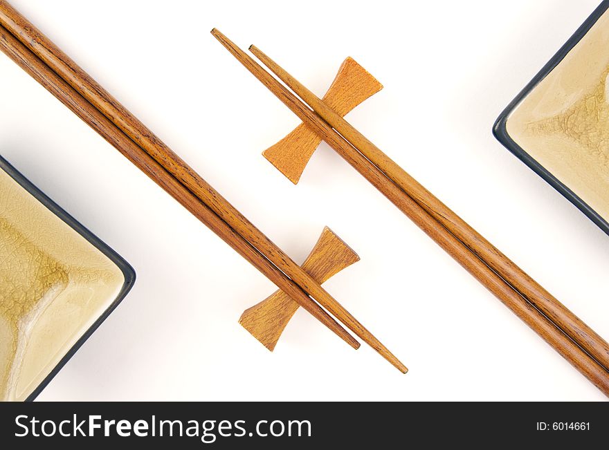 Abstract Chopsticks and Bowls Isolated on a White Background.