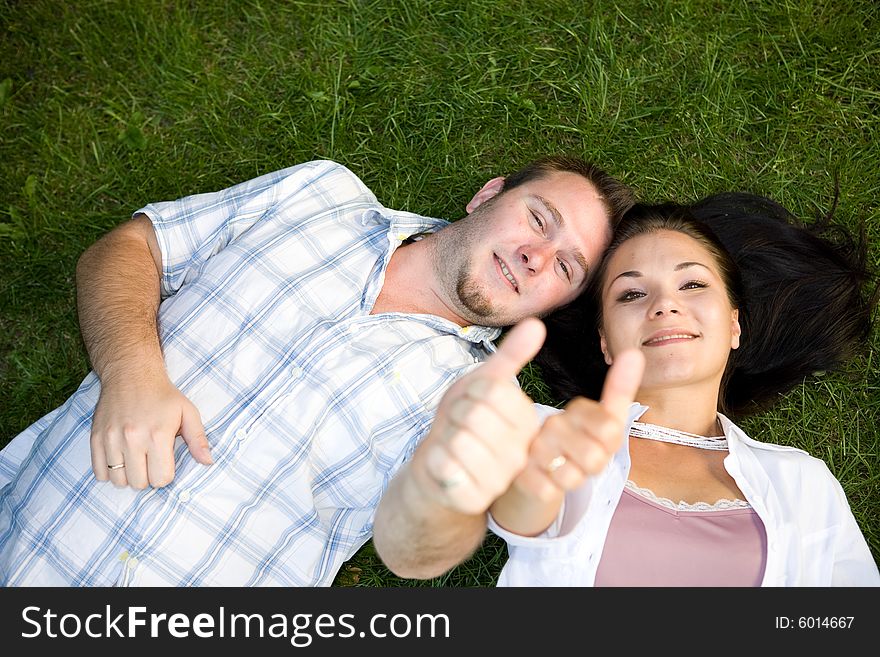 Happy couple lying on grass. Happy couple lying on grass