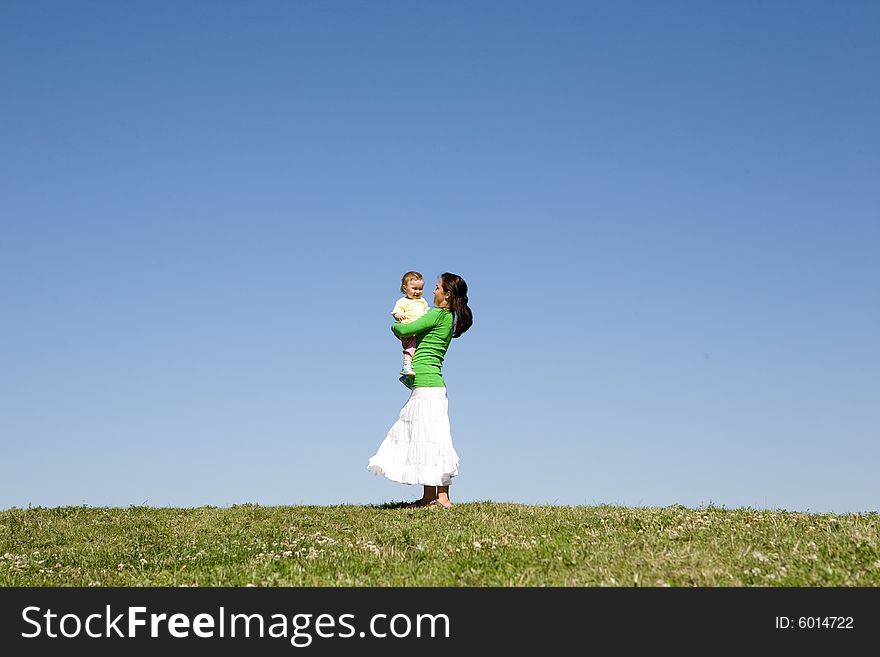 Active family on green meadow. Active family on green meadow