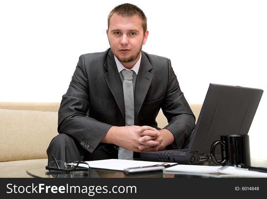 Happy man sitting on sofa with laptop. Happy man sitting on sofa with laptop