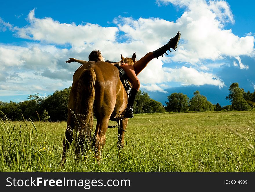 Woman and horse blue sky