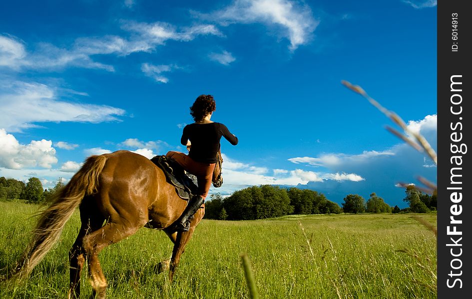 Woman and horse blue sky