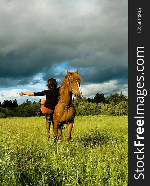 Woman and horse blue sky