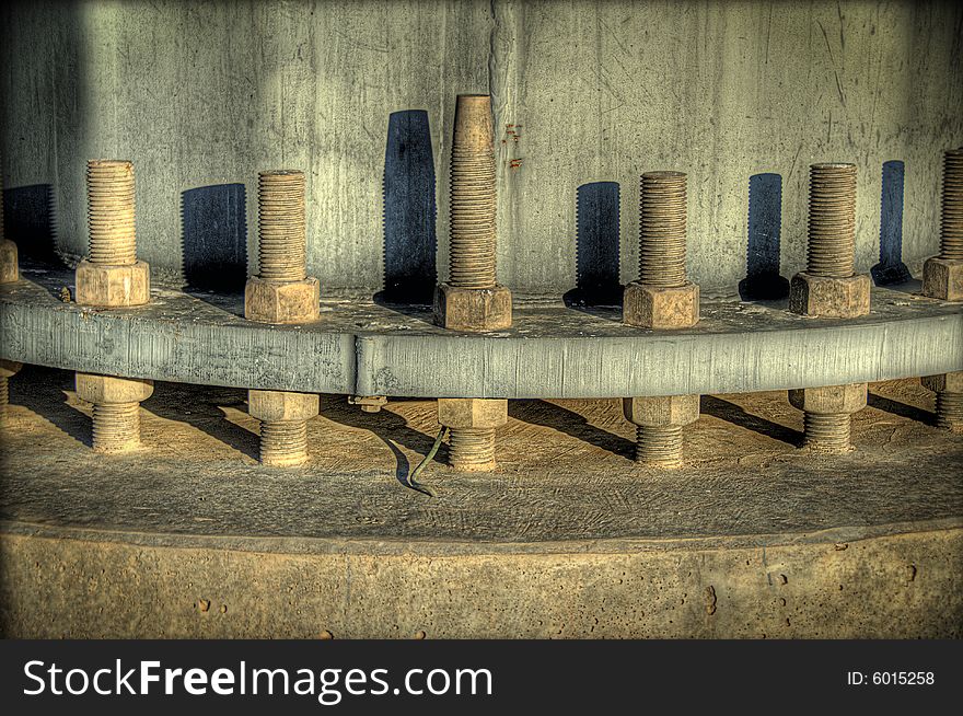 Steel Power Pole Connected to the Base of a Concrete Support. Steel Power Pole Connected to the Base of a Concrete Support