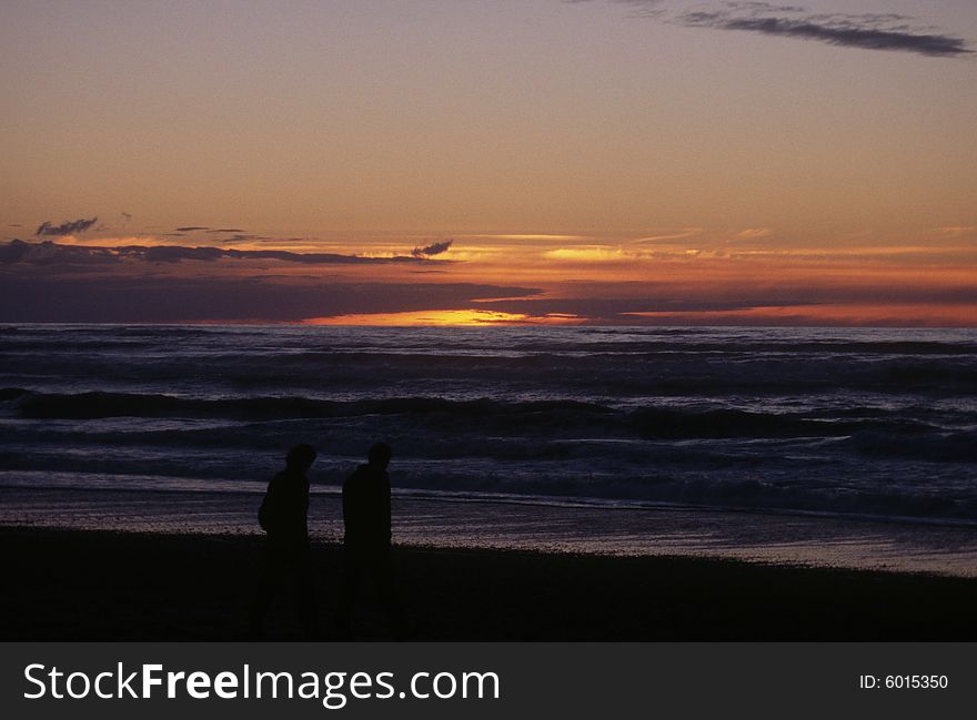Sunset over Punakaiki beach on the west coast of New Zealand's South Island.