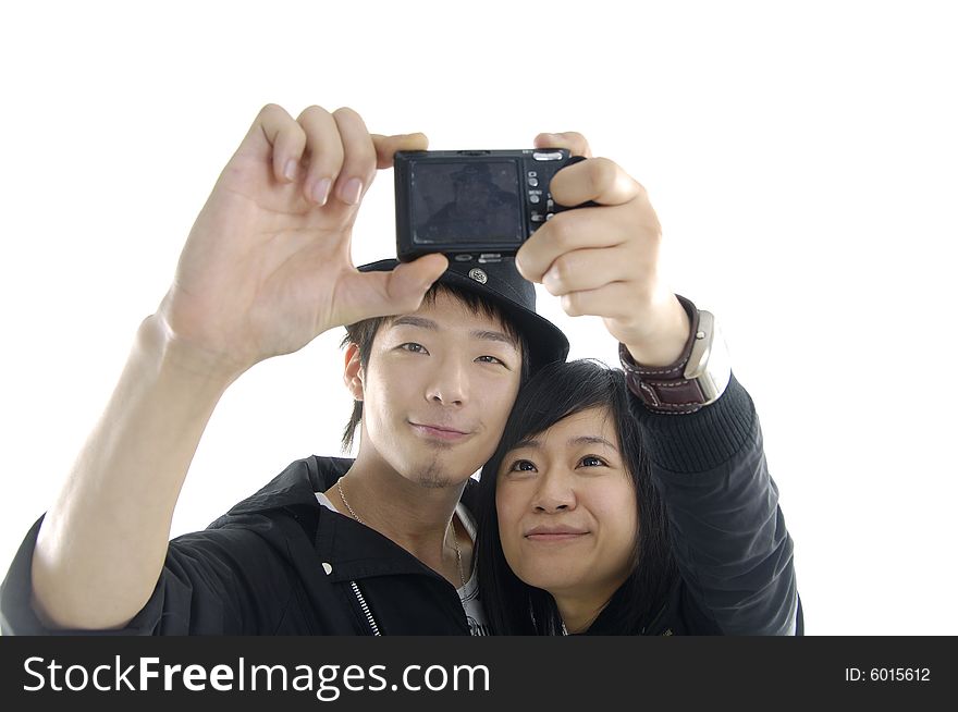An attractive couple together taking a selfportrait