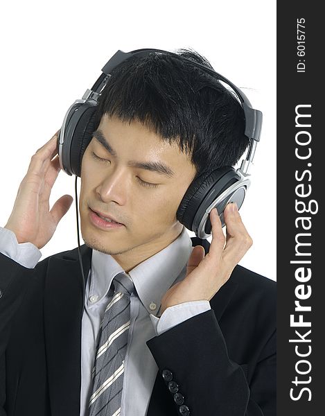 Business man listening to music, isolated in white background