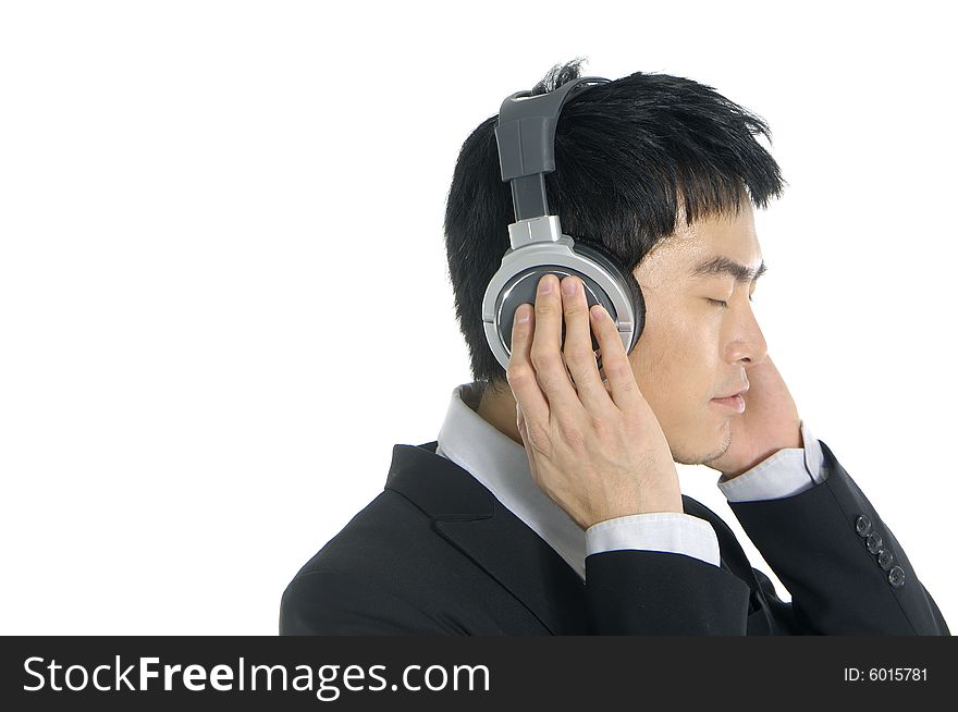 Business man listening to music, isolated in white background