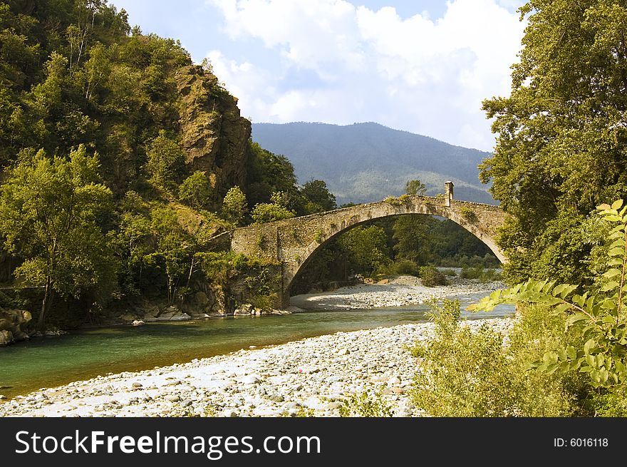 The legend says that It was the devil that built this bridge over the green waters of river Stura (Italy). The legend says that It was the devil that built this bridge over the green waters of river Stura (Italy).