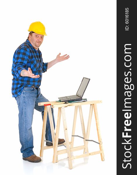 Carpenter at work with laptop, white background, reflective surface, studio shot