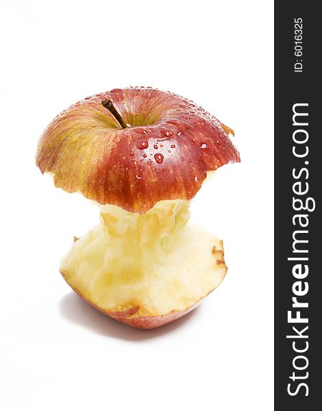 Isolated red apple stump with drops