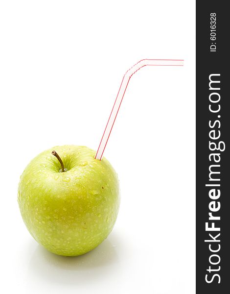 Isolated green apple with straw. Isolated green apple with straw