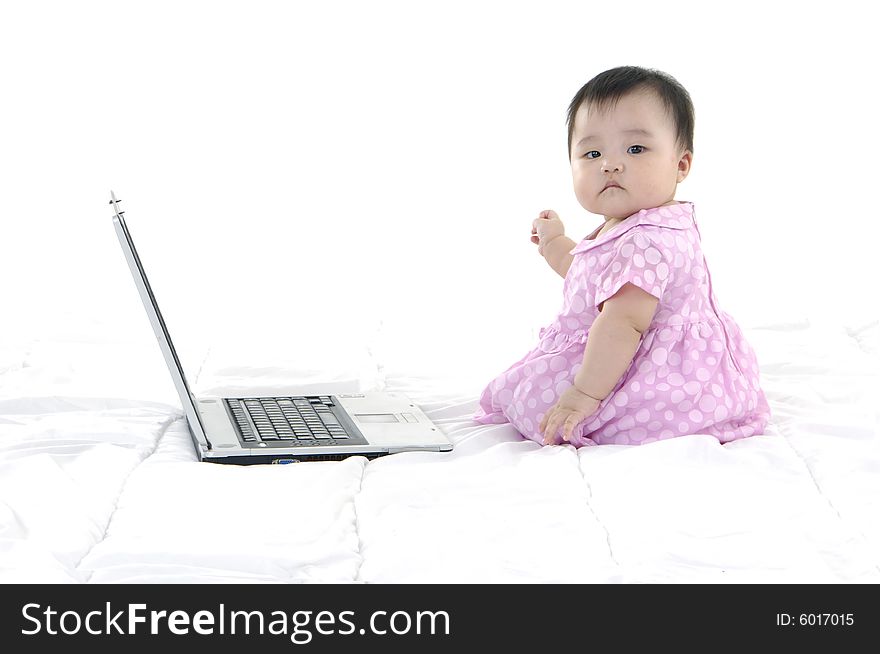 Small baby with laptop isolated. Small baby with laptop isolated