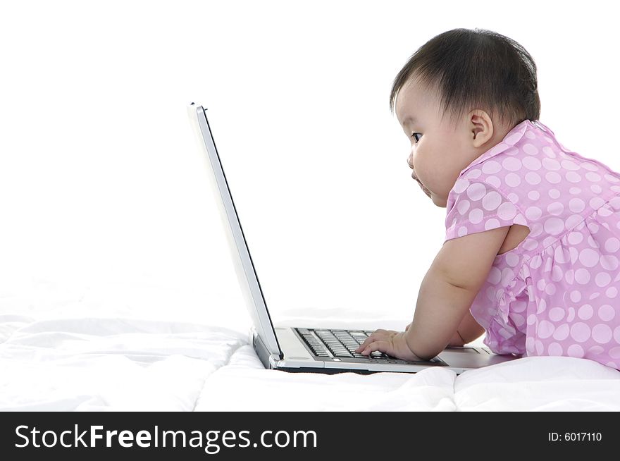 Small baby with laptop isolated. Small baby with laptop isolated