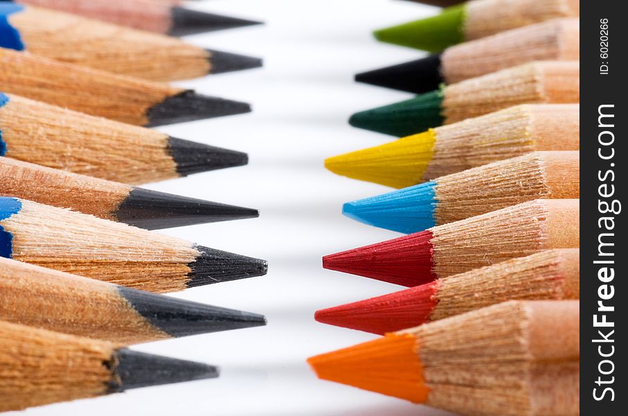 Many pencils of different colors in two rows. Many pencils of different colors in two rows
