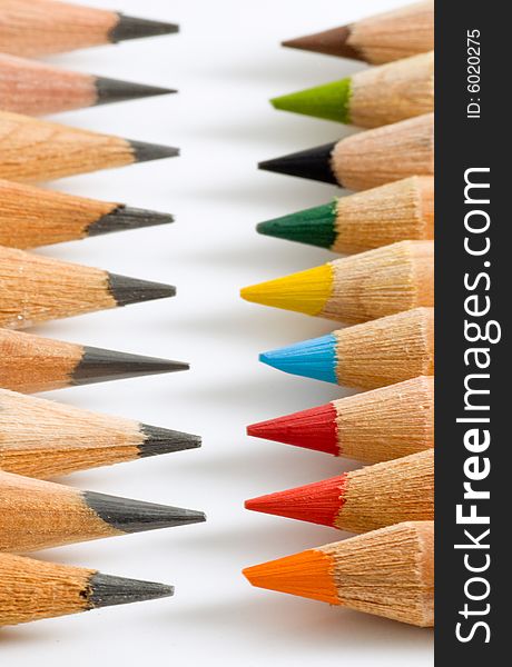 Many pencils of different colors in two rows. Many pencils of different colors in two rows