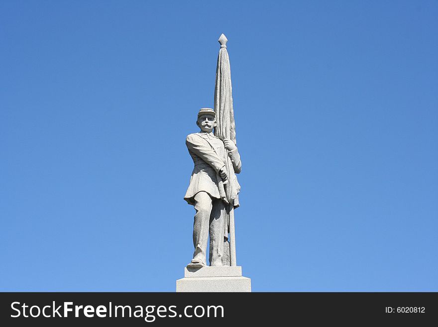 Statue of a man on a beautiful blue sky background