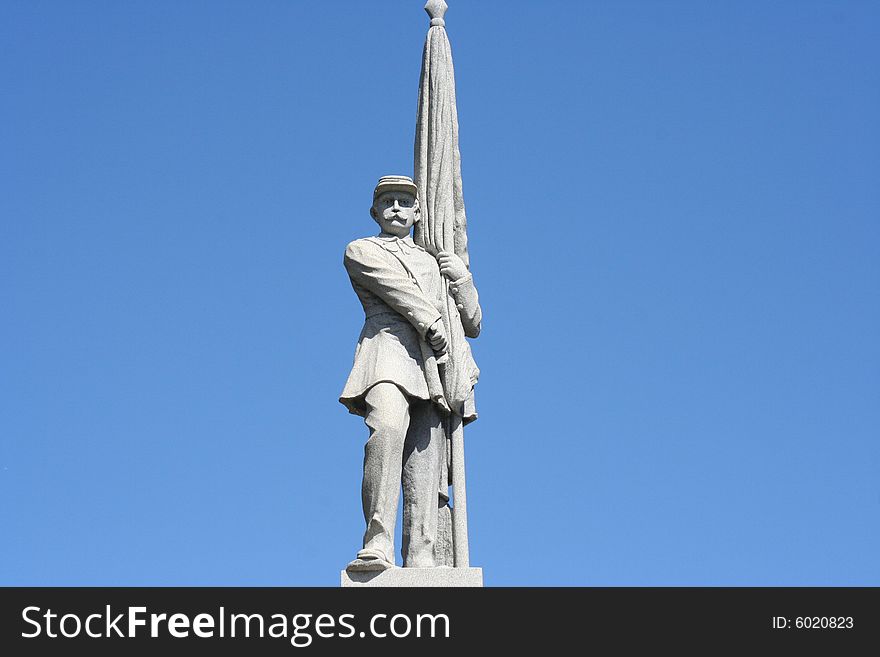 Statue of a man on a beautiful blue sky background