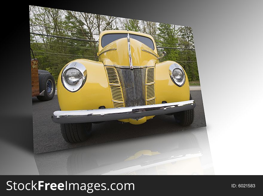 Image of old yellow car sitting on a table. Image of old yellow car sitting on a table