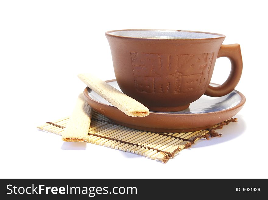 Ceramic cup and cookies isolated on white