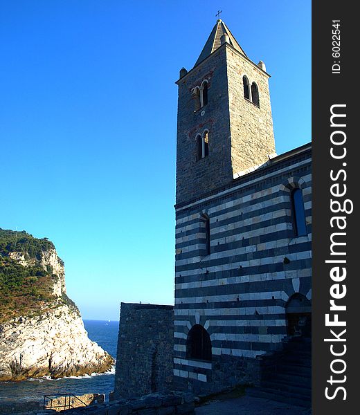 A beautiful shot of the bell rower of San Pietro curch and the entrance of Porto Venere gulf. A beautiful shot of the bell rower of San Pietro curch and the entrance of Porto Venere gulf